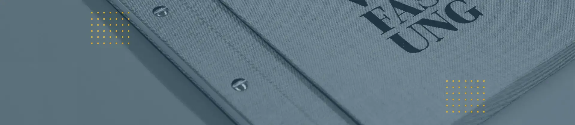 Header image: Close-up of a gray folder with metal book screws and embossing; symbolizing binding services.