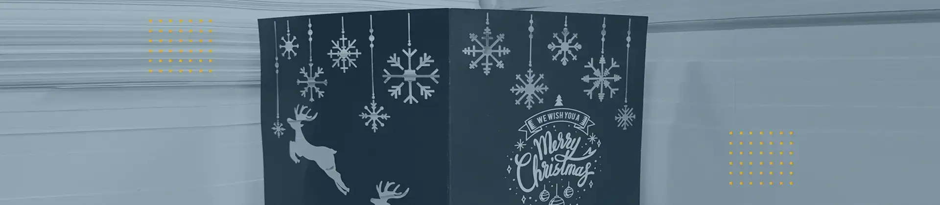 Header image: Stacked postcards or documents with a dark cover and white Christmas design; symbolizing digital printing.