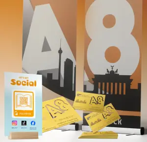 Promotional material printing: Roll-up, business cards, and social media display with Berlin motif.