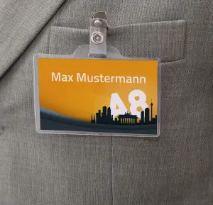 Close-up of a personalized name badge with Berlin motif on a suit.